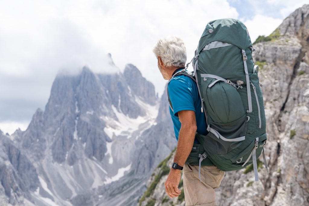 pexels-photo-20446154-20446154 Senior man with backpack hiking through the stunning Dolomites in Italy, enjoying the adventure.